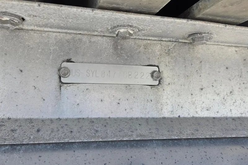 Slide: The Image of VIN plate on 2022 Sylvan Mirage X X3 boat, displaying identification number. - 16