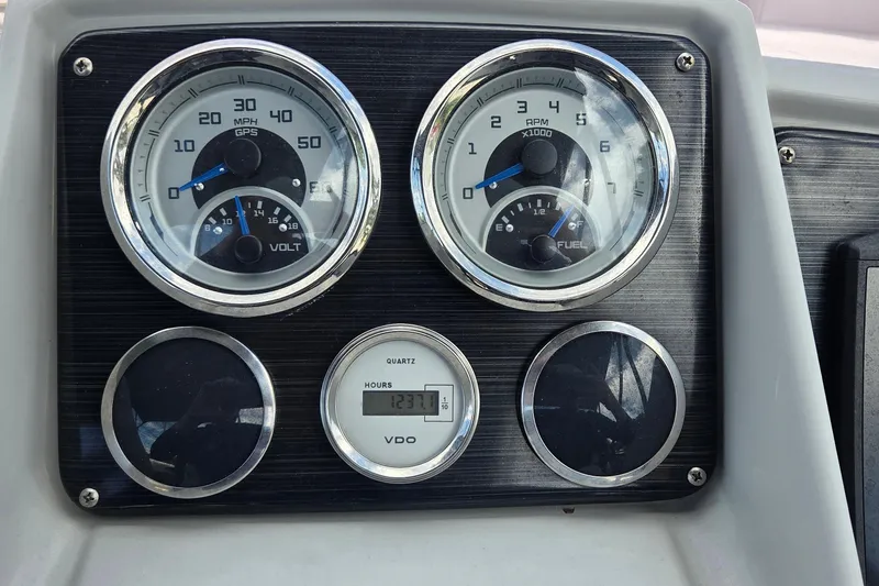 Slide: The Image of Dashboard of 2022 Sylvan Mirage X X3 with speedometer, RPM, volt, and fuel gauges. - 3