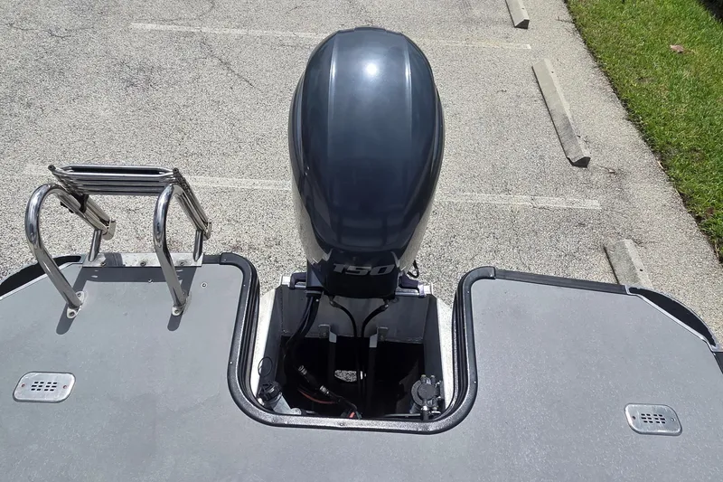 Slide: The Image of 2022 Sylvan Mirage X X3 boat with outboard motor and swim ladder. - 6