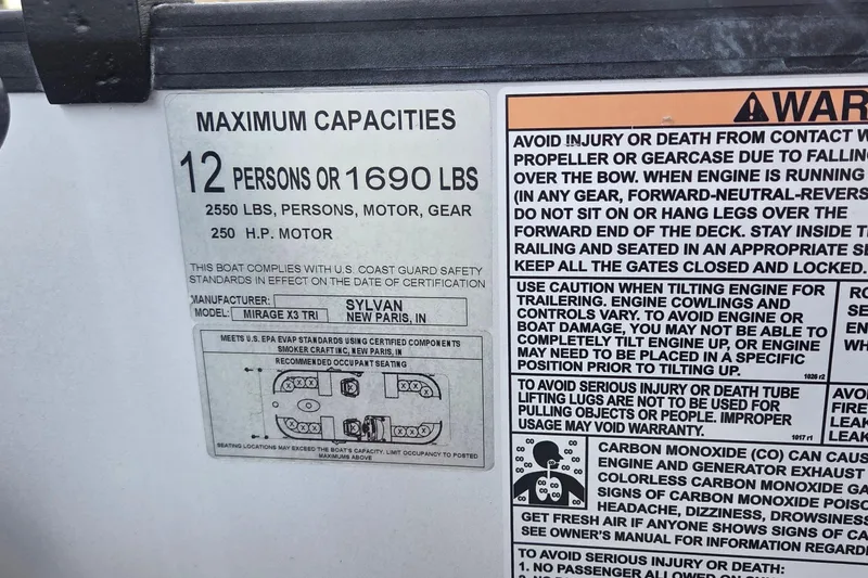 Slide: The Image of 2022 Sylvan Mirage X X3 capacity label, 12 persons or 1690 lbs, safety warnings included. - 9