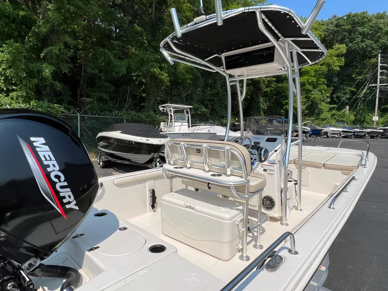 Slide: The Image of 2020 Carolina Skiff 21 LS boat with Mercury engine, parked outdoors. - 1