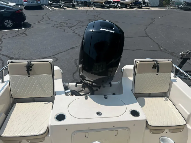 Slide: The Image of 2020 Carolina Skiff 21 LS boat with Mercury outboard motor and cushioned seating. - 16