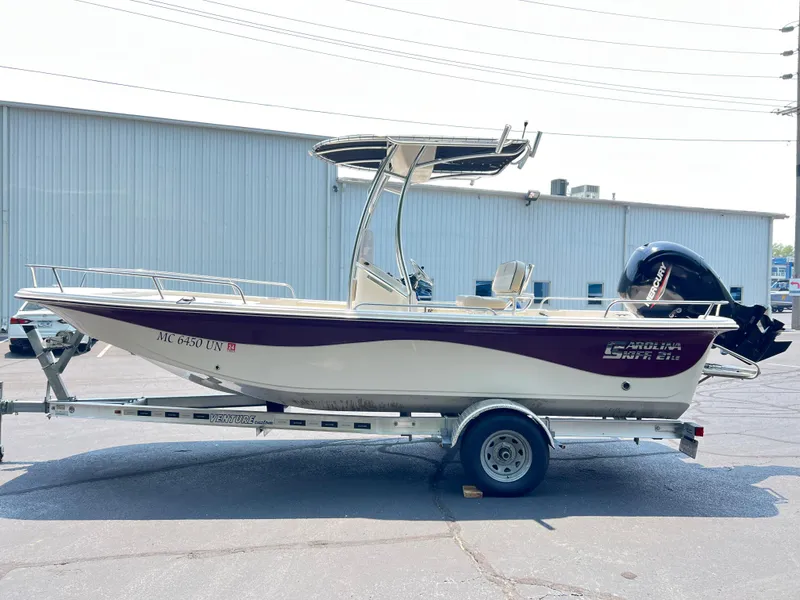 Slide: The Image of 2020 Carolina Skiff 21 LS boat on trailer, parked outdoors. - 17