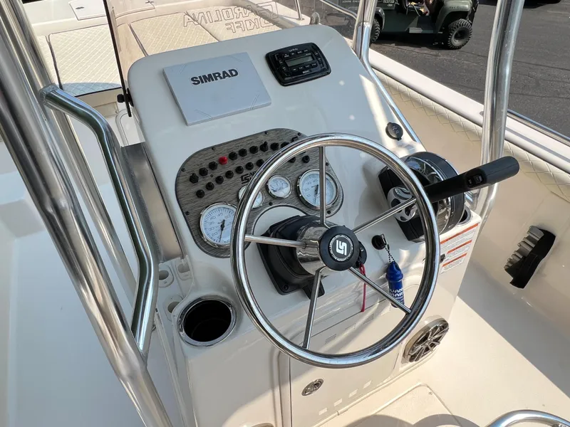 Slide: The Image of 2020 Carolina Skiff 21 LS boat console with steering wheel and gauges. - 4