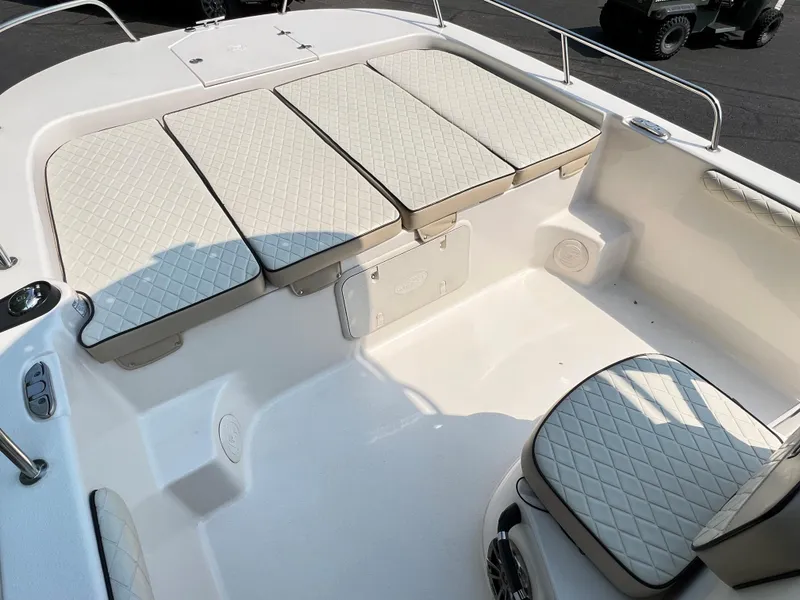 Slide: The Image of 2020 Carolina Skiff 21 LS boat interior with cushioned seating and storage. - 5
