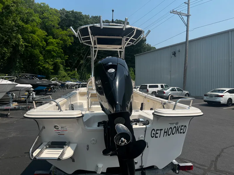 Slide: The Image of 2020 Carolina Skiff 21 LS boat with outboard motor, parked outdoors. - 9