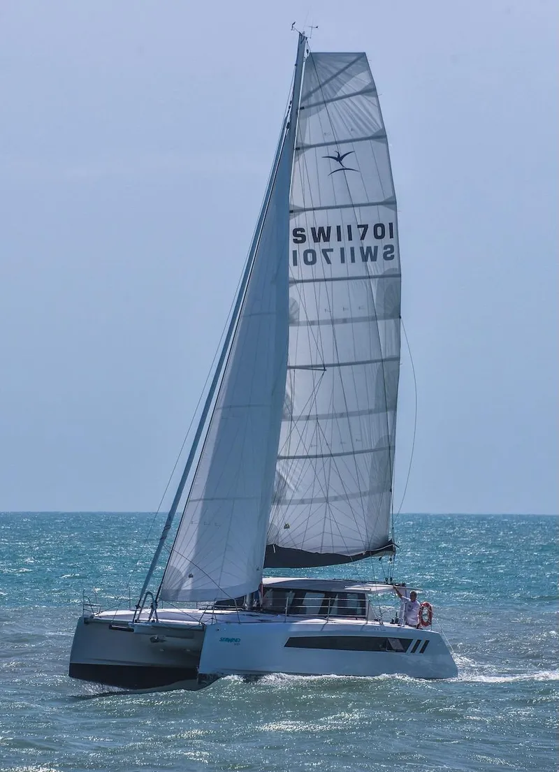 Slide: The Image of 2025 Seawind 1170 catamaran sailing on open sea. - 27