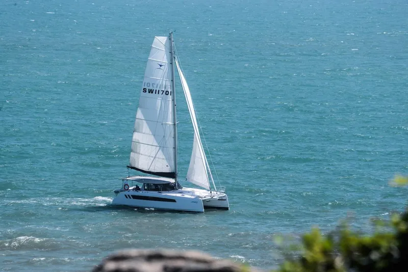 Slide: The Image of 2025 Seawind 1170 catamaran sailing on open ocean waters. - 30