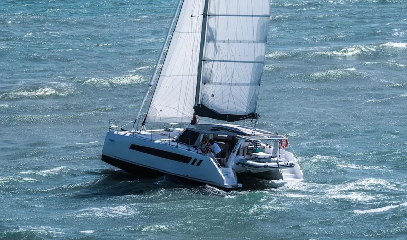 Slide: The Image of 2025 Seawind 1170 catamaran sailing on choppy ocean waters. - 33