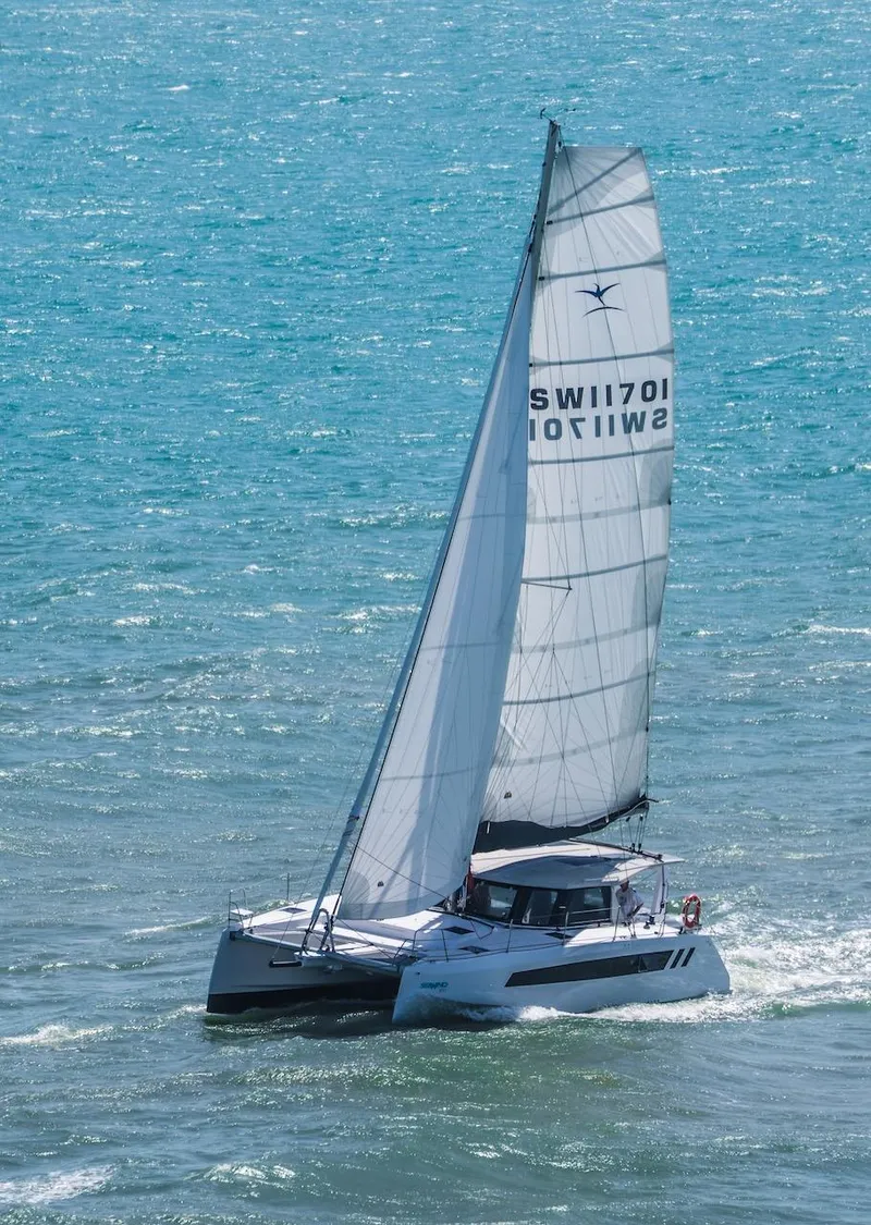 Slide: The Image of 2025 Seawind 1170 catamaran sailing on open ocean waters. - 35
