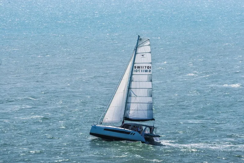 Slide: The Image of Sailing catamaran Seawind 1170, 2025 model, gliding on open ocean waters. - 39