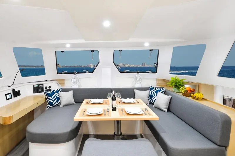 Slide: The Image of Luxurious interior of 2025 Seawind 1170 catamaran with dining area and ocean view. - 46