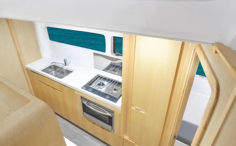 Slide: The Image of Modern kitchen interior of 2025 Seawind 1170 yacht with ocean view. - 48