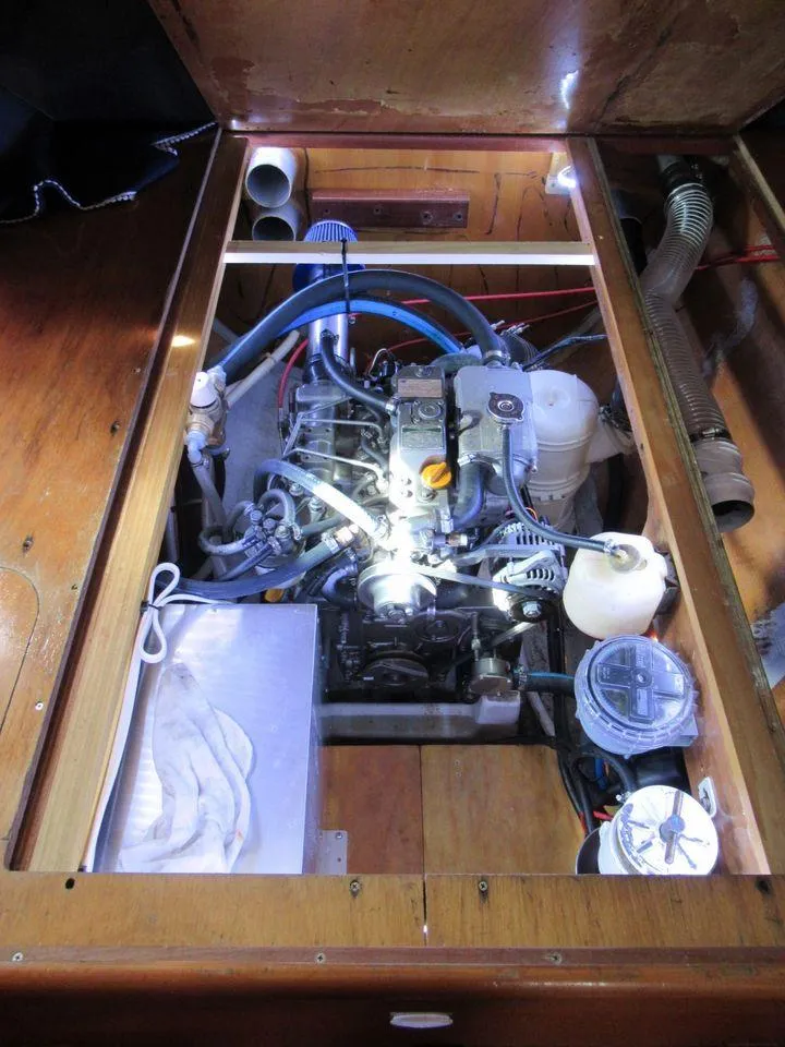 Slide: The Image of Engine compartment of a 2005 Lagoon 410 catamaran with visible components and wiring. - 14