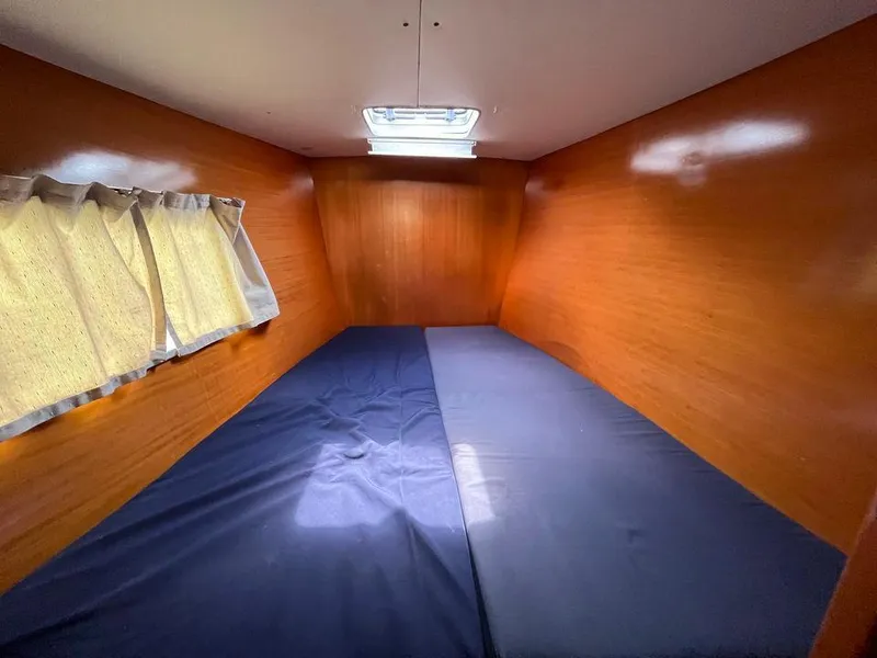 Slide: The Image of Lagoon 410 2005 model cabin with wooden walls and a skylight. - 16