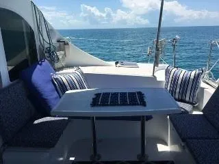Slide: The Image of Lagoon 410 catamaran deck with seating area, ocean view, 2005 model. - 3