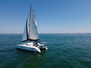 Slide: The Image of Lagoon 410 catamaran sailing on open water, 2005 model. - 8