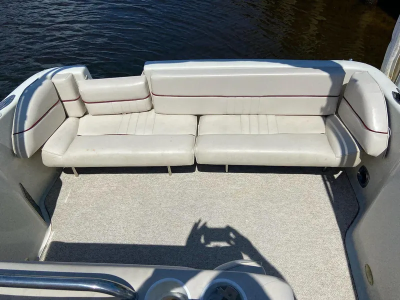 Slide: The Image of 1997 Crownline 250 CR boat interior with beige seating and carpeted floor. - 10