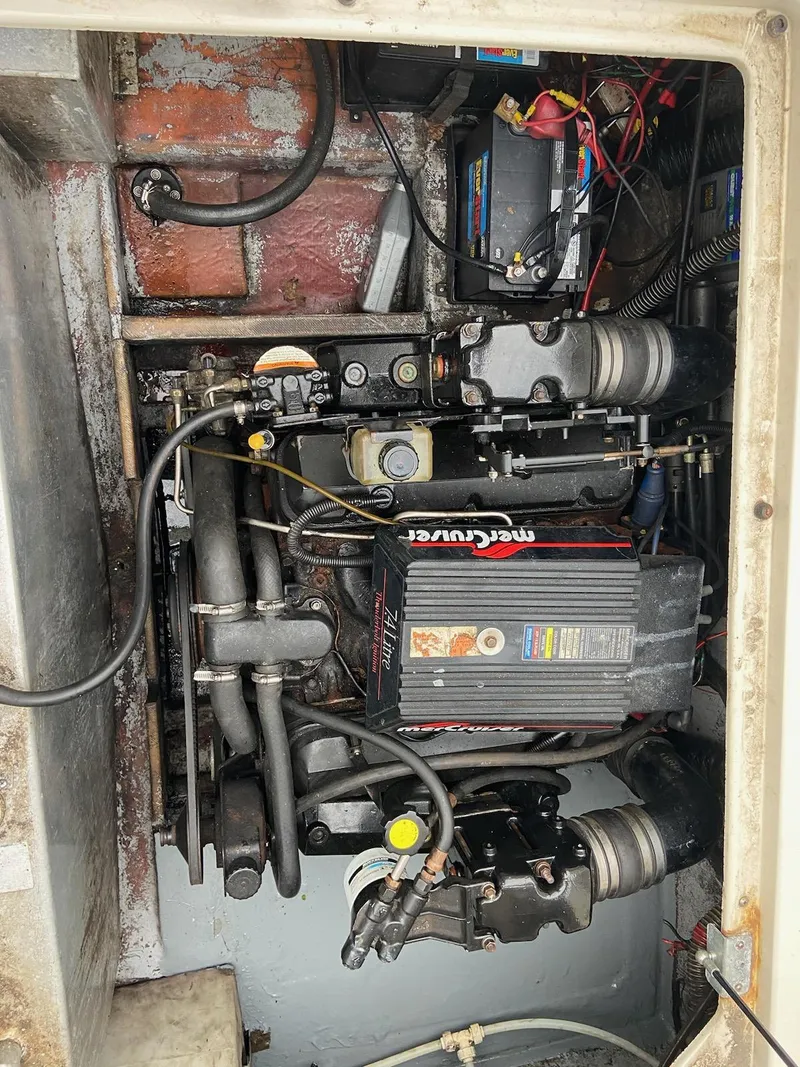 Slide: The Image of Engine compartment of a 1997 Crownline 250 CR boat, featuring a MerCruiser engine. - 11