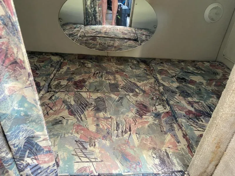 Slide: The Image of Interior cabin of a 1997 Crownline 250 CR boat with patterned upholstery. - 8