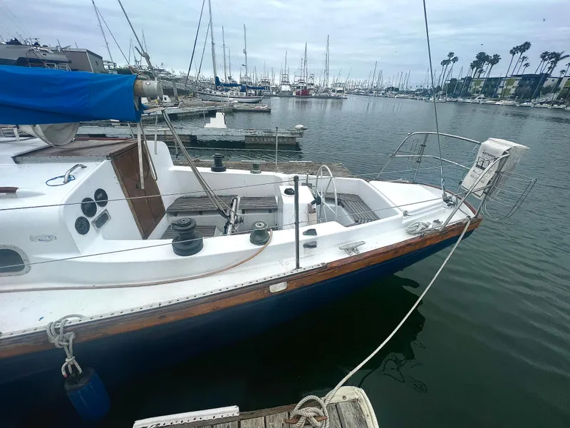 Slide: The Image of 1977 Van De Stadt Rebel 42 sailboat docked in a marina, overcast sky. - 12