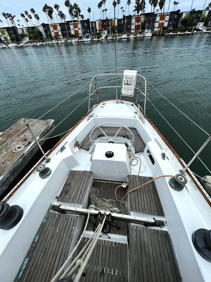 Slide: The Image of 1977 Van De Stadt Rebel 42 sailboat deck with marina view in the background. - 20