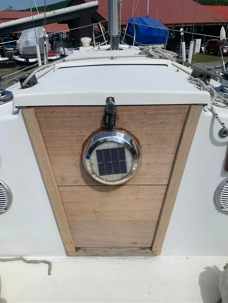 Slide: The Image of 1979 Sabre 28-2 sailboat with wooden hatch and solar-powered vent. - 15