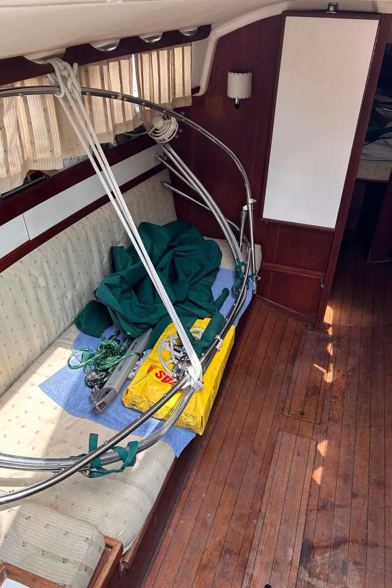 Slide: The Image of Interior of a 1979 Sabre 28-2 sailboat with wooden flooring and seating area. - 32