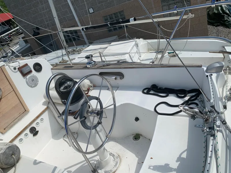 Slide: The Image of 1979 Sabre 28-2 sailboat cockpit with steering wheel and rigging. - 7
