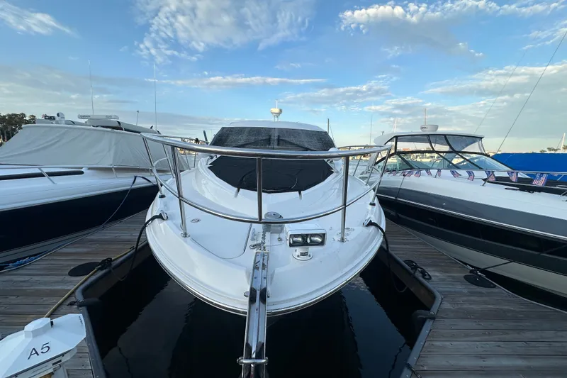 Slide: The Image of 2017 Sea Ray Sundancer 400 yacht docked at marina under blue sky. - 49