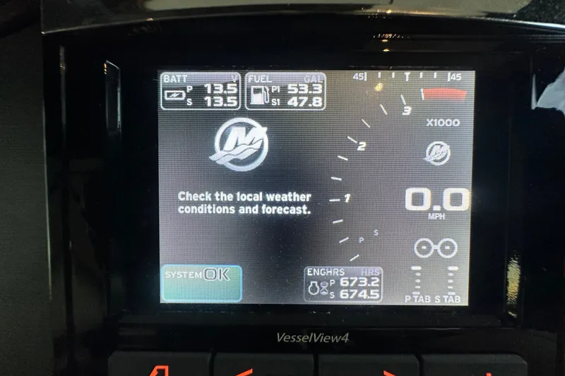 Slide: The Image of Dashboard display of a 2017 Sea Ray Sundancer 400, showing system status and fuel levels. - 59