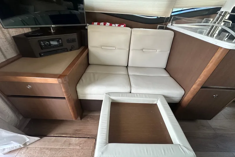 Slide: The Image of Interior of 2017 Sea Ray Sundancer 400 yacht with cozy seating and entertainment system. - 56