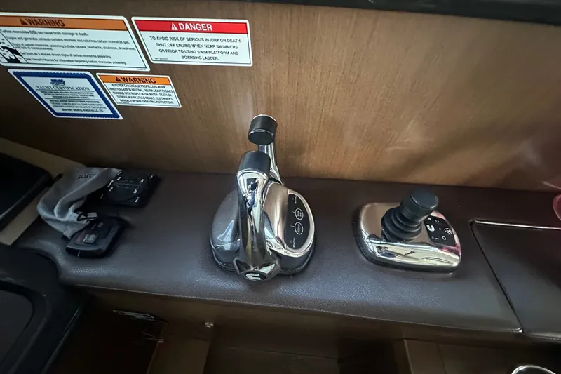 Slide: The Image of Control panel of a 2017 Sea Ray Sundancer 400 yacht with warning labels. - 64