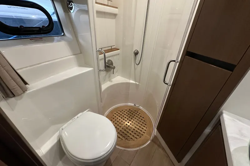 Slide: The Image of Luxurious bathroom in 2017 Sea Ray Sundancer 400 yacht with shower and toilet. - 44