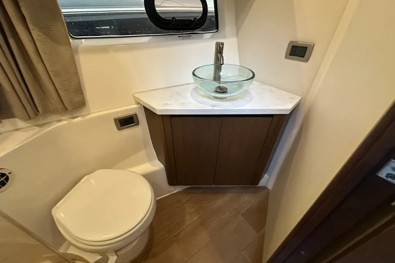 Slide: The Image of Luxurious bathroom in 2017 Sea Ray Sundancer 400 yacht with modern fixtures and elegant design. - 65