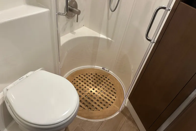 Slide: The Image of Bathroom interior of 2017 Sea Ray Sundancer 400 yacht, featuring shower and toilet. - 60