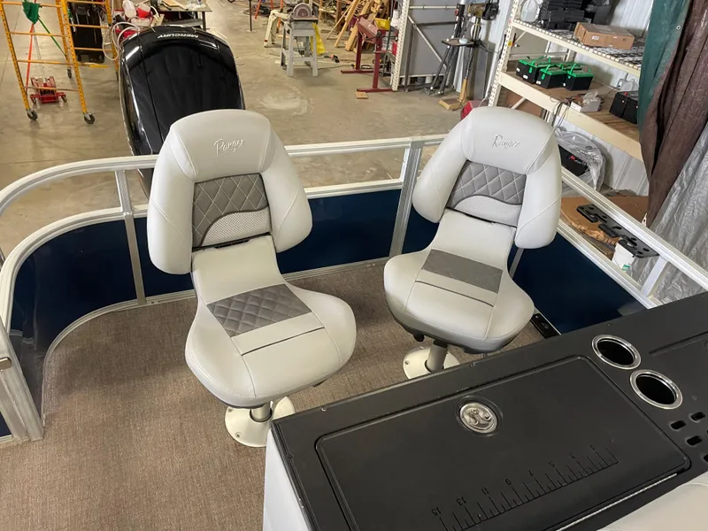 Slide: The Image of Two Ranger 220FC boat seats in a workshop setting, 2020 model. - 14