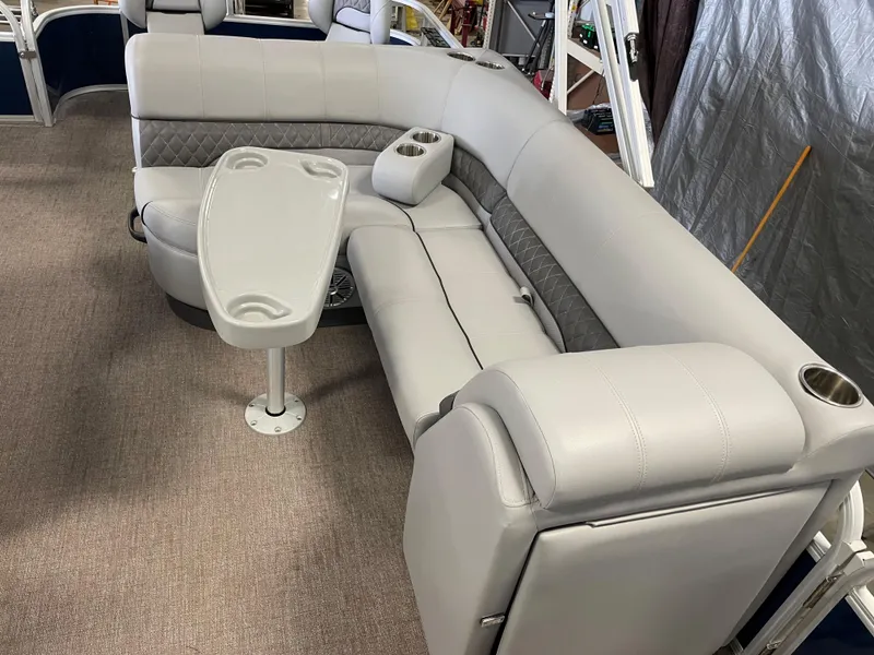 Slide: The Image of 2020 Ranger 220FC boat interior with gray seating and table. - 5