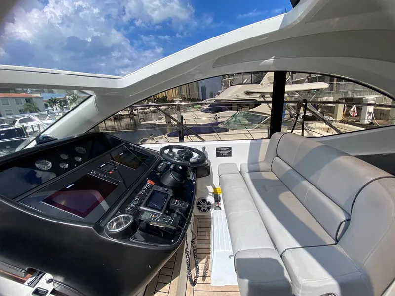 Slide: The Image of Interior view of 2014 Sunseeker 48 Portofino XPS yacht cockpit with seating and controls. - 13