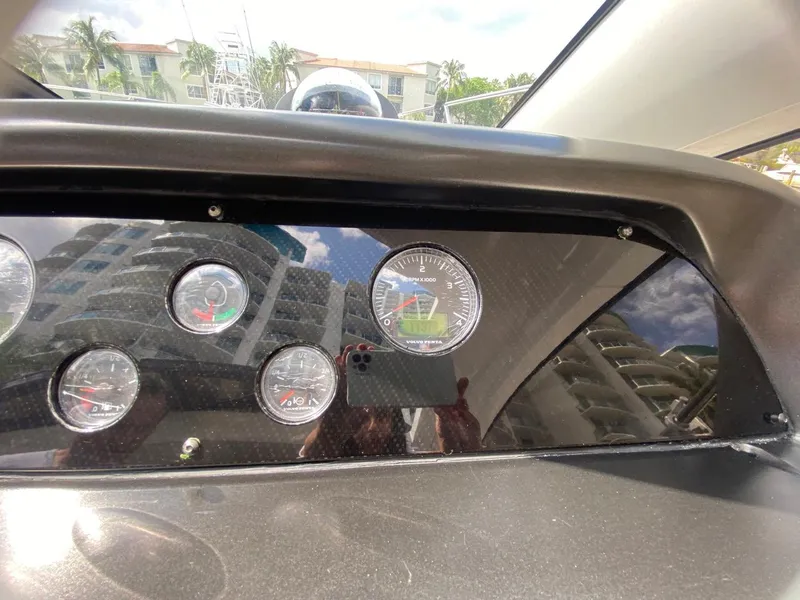 Slide: The Image of Dashboard of 2014 Sunseeker 48 Portofino XPS yacht with gauges and reflections. - 14