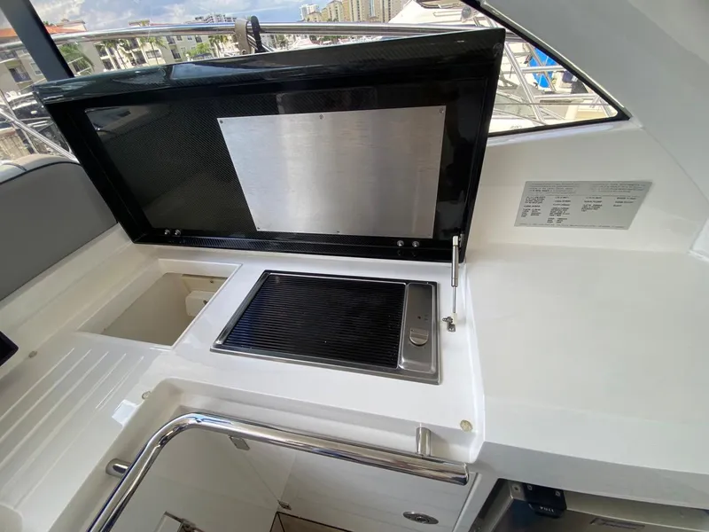 Slide: The Image of Sunseeker 48 Portofino XPS 2014 yacht interior with built-in grill and sink. - 19