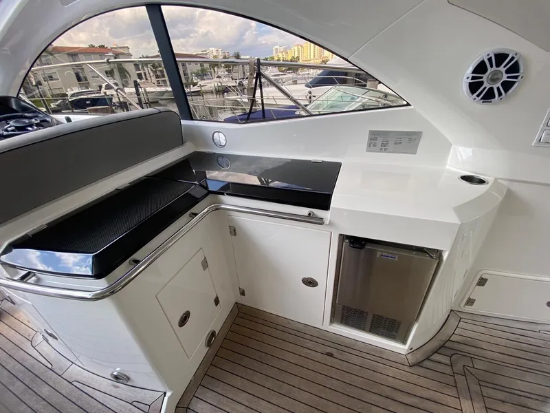 Slide: The Image of Luxurious 2014 Sunseeker 48 Portofino XPS yacht interior with sleek kitchenette and modern amenities. - 20