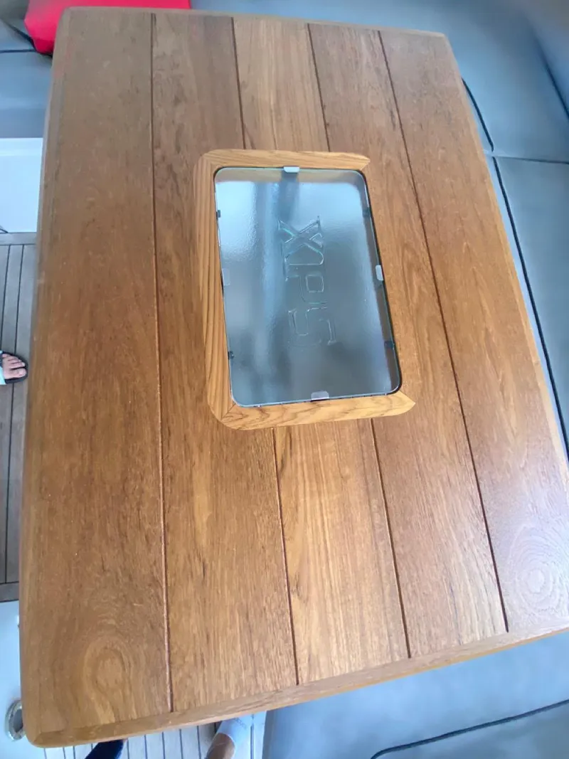 Slide: The Image of Wooden table with glass insert on 2014 Sunseeker 48 Portofino XPS yacht. - 24