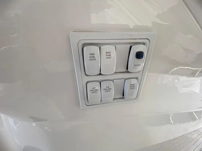 Slide: The Image of Control panel on 2014 Sunseeker 48 Portofino XPS yacht, featuring various light switches. - 26