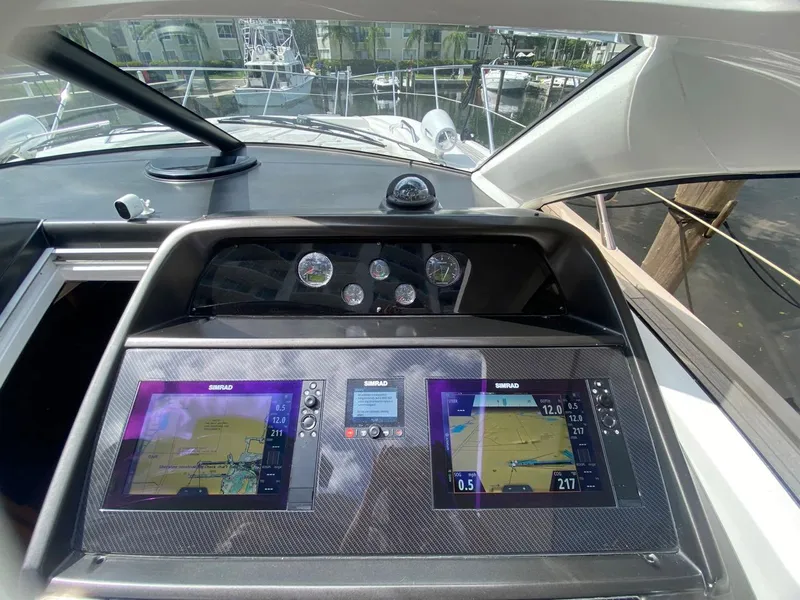 Slide: The Image of Sunseeker 48 Portofino XPS 2014 yacht dashboard with navigation screens and gauges. - 7