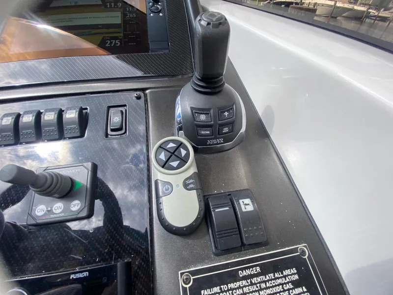 Slide: The Image of Control panel of 2014 Sunseeker 48 Portofino XPS yacht with joystick and switches. - 8