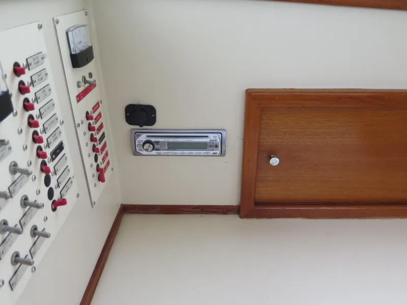 Slide: The Image of Control panel and wooden cabinet inside 1988 Blackman 26 Billfisher boat. - 11