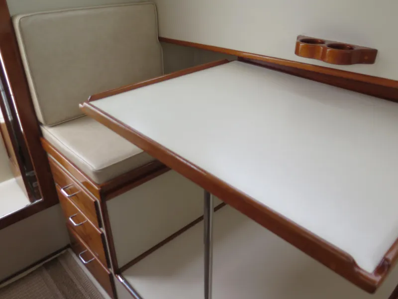 Slide: The Image of Interior of 1988 Blackman 26 Billfisher boat with wooden cabinetry and seating. - 14