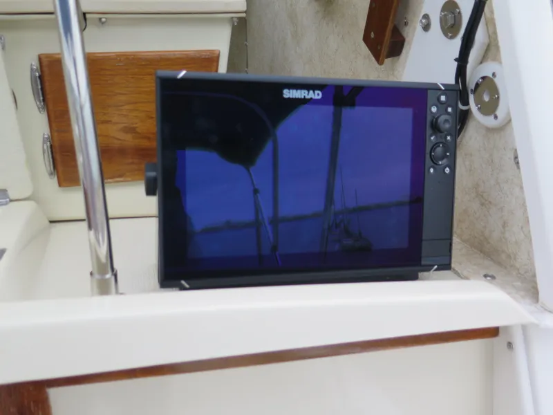 Slide: The Image of Simrad navigation system on 1988 Blackman 26 Billfisher boat dashboard. - 16