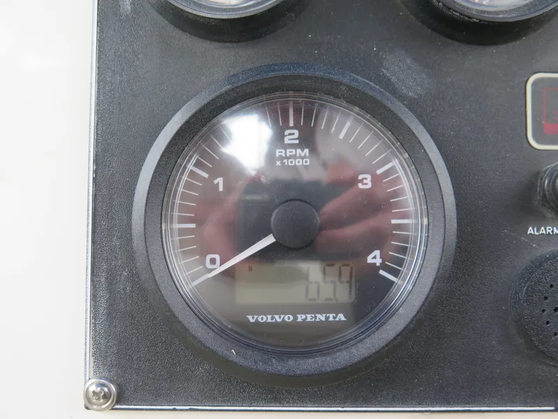 Slide: The Image of Volvo Penta RPM gauge on 1988 Blackman 26 Billfisher boat dashboard. - 29